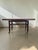 Beautiful Scandinavian coffee table from the 1960s, featuring an Indonesian rosewood top with a stunning, high-contrast...