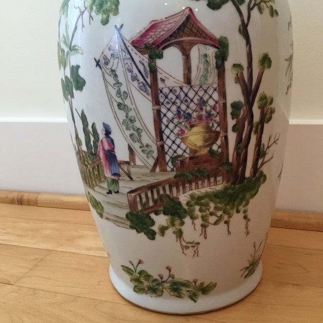 This is a gorgeous vase. It is hand painted and the colors are vivid and stunning. There is a gold rim at the top and...