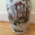 This is a gorgeous vase. It is hand painted and the colors are vivid and stunning. There is a gold rim at the top and...