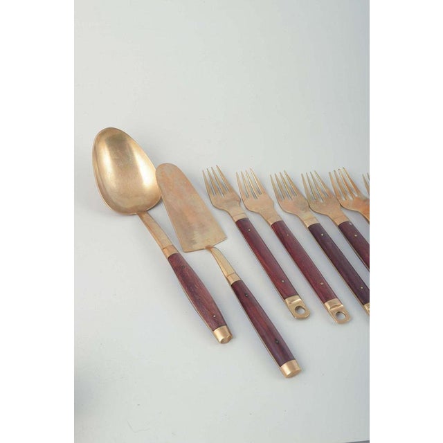 Brøste. Complete 8-person dinner cutlery set in bronze and rosewood, model 222. Comprising 8 knives (l. 20.5 cm.), 8 forks...