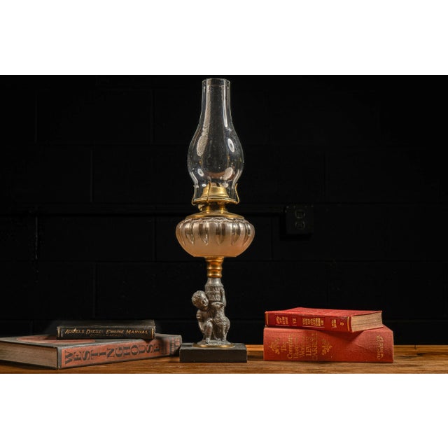c. 1950s; The Plume & Atwood Manufacturing Co. - Thomaston, CT Vintage tabletop oil lamp with figural base. This piece...
