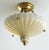 The elegant Lenox Quoizel shell inspired brass accent pendant chandelier is a traditional style chandelier featuring a...