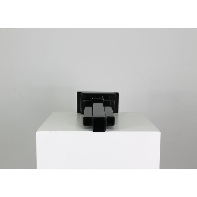 This ceramic piece is part of the Yantra series by Ettore Sottsass, a collection of thirty-nine forms including...