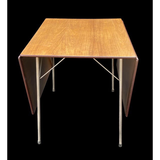 This is an excellent. untouched original example of this drop leaf dining table, the top has a wonderful patina, and the...