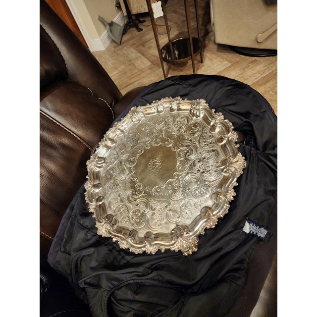 Beautiful antique silver plated tray...very ornate and heavy. There is a monogram which I can't make out. Also this is...