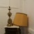 Brass Table Lamp with Italian Classical Mask and Mounts to the Base This lamp is made in brass and it has a shaped bulbous...
