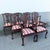 Side chairs: 22.75”w, 20.5”d, 40.5”h This exceptional set of nine Vintage Chippendale style dining chairs showcases...