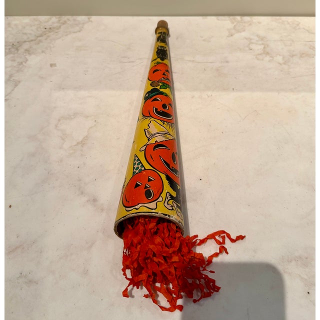 Vintage 1930s collection of Halloween noisemaker and blowers, streamers and tissue honeycomb, along with a clown make up...