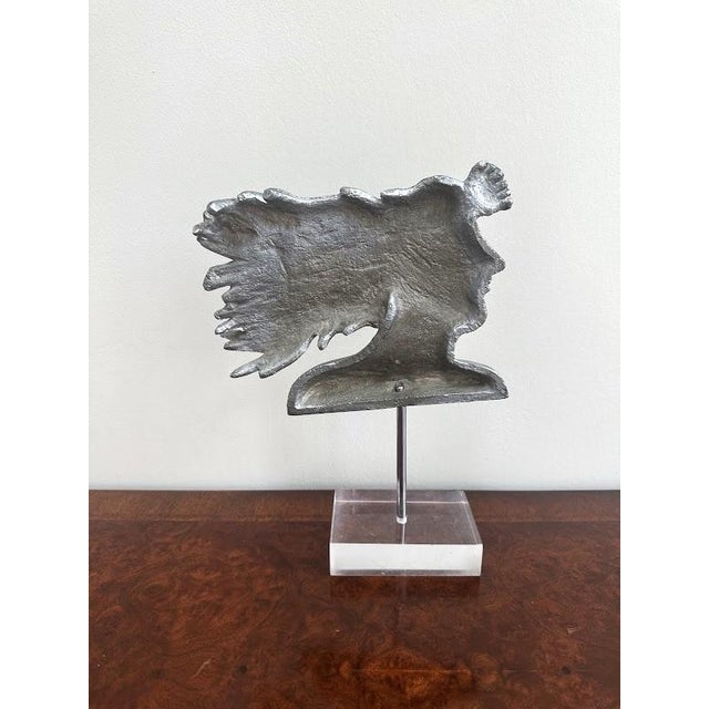 Contemporary Cast Aluminum Sculpture on Lucite Stand. The stem detaches from the base. The piece is pretty heavy.