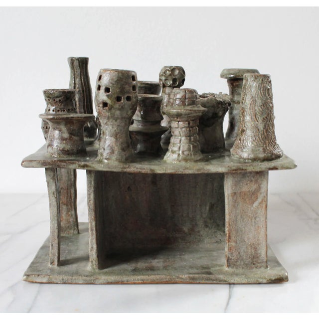 Studio art modernist pottery candelabra. Holds 14 candles. Signed by artist on bottom. No chips.