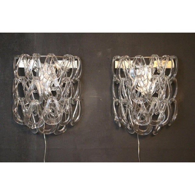 This beautiful pair of sconces by Angelo Mangiarotti for Vistosi features an series of interlinked ovoid shades in...