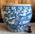 Beautiful large Chinoiserie blue and white porcelain cachepot featuring a continuous hand-painted landscape scene with...
