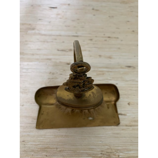 Unique brass fireplace tool set with the Mayflower ship on handle. Tools include brush and a pan.