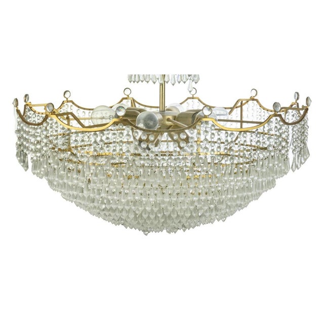 Crystal Drops Chandelier, Italy 1970s. Gilded Brass, 10 lights. Very good condition. Up to 250V (Europe/UK Standard).The...