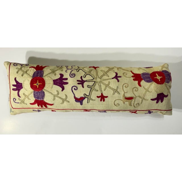 This beautiful Suzani pillow is a true treasure, showcasing the artistry and craftsmanship of the past. Hand embroidered...
