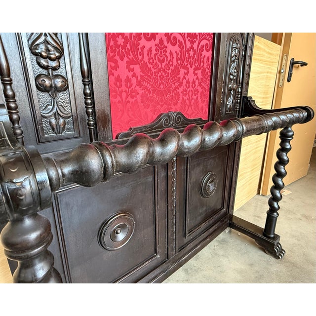 Large carved Spanish solid walnut coat rack stand has all of the original hardware which is heavy cast iron and has been...