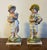 Pair antique early 19th century English figures in the Staffordshire manner, though these are porcelain. A boy and girl -...