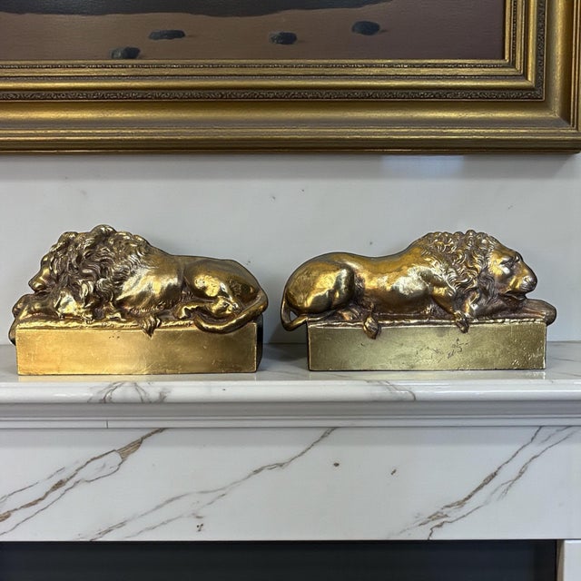 A handsome pair of European brass lion bookends executed in the neoclassical tradition and inspired by the work of Antonio...