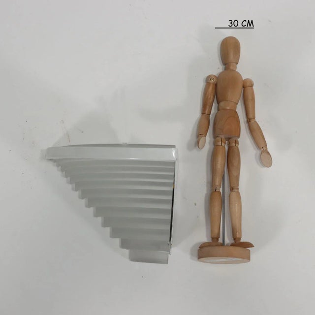 Pair of wall angle lamps. Enameled metal, glass. This piece is attributed to the mentioned designer/maker. It has no...