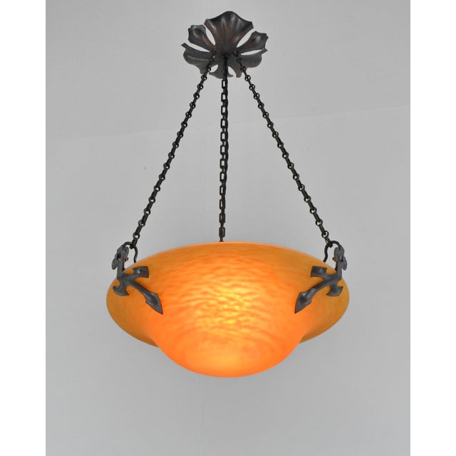 Daum freres & Louis Majorelle A wonderful French art deco hanging fixture in wrought iron with a Daum bowl in mottled...