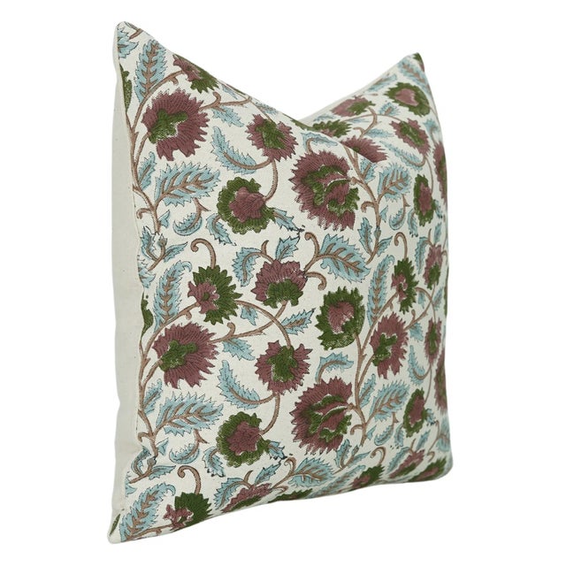 The Mandakini cushion cover draws inspiration from the tranquil flow of sacred rivers, featuring a graceful hand block...