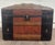 This is a striking antique Victorian dome-top immigrant or steamer trunk dating to the late 1800s. It features richly...