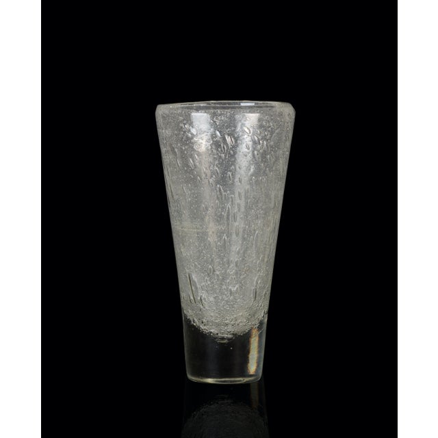 Blown glass vase is a beautiful glass decorative object, realized by an Italian manufacture during the 1970s. Very...