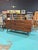 Expertly crafted, the Mid-Century Walnut Lowboy Dresser , by United, makers mark on the inside drawer exemplifies timeless...