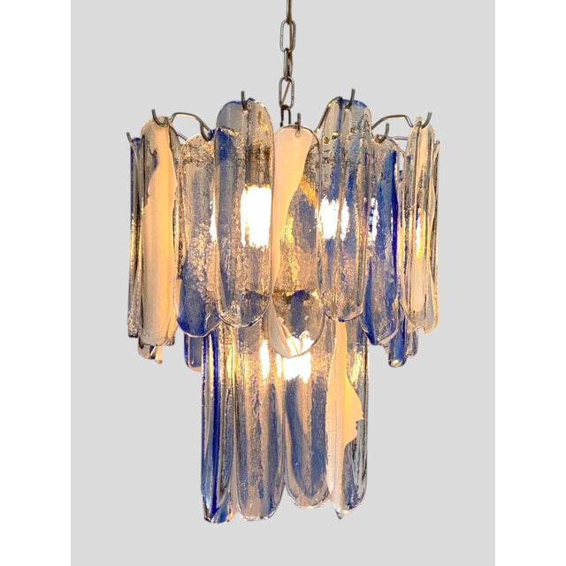 Immerse your space in coastal sophistication with the Blue Riviera chandelier — a dazzling example of 1970s Murano...