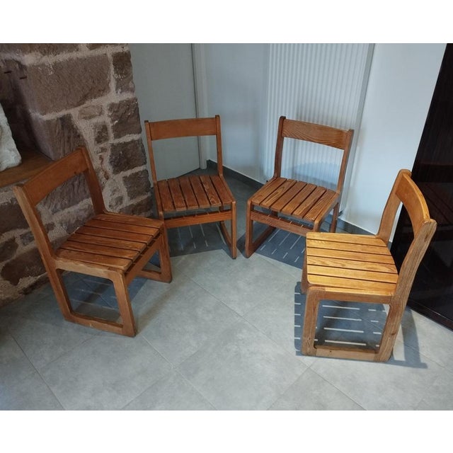This beautiful set of four antique sled-style chairs in light pine embodies the timeless elegance of minimalist...