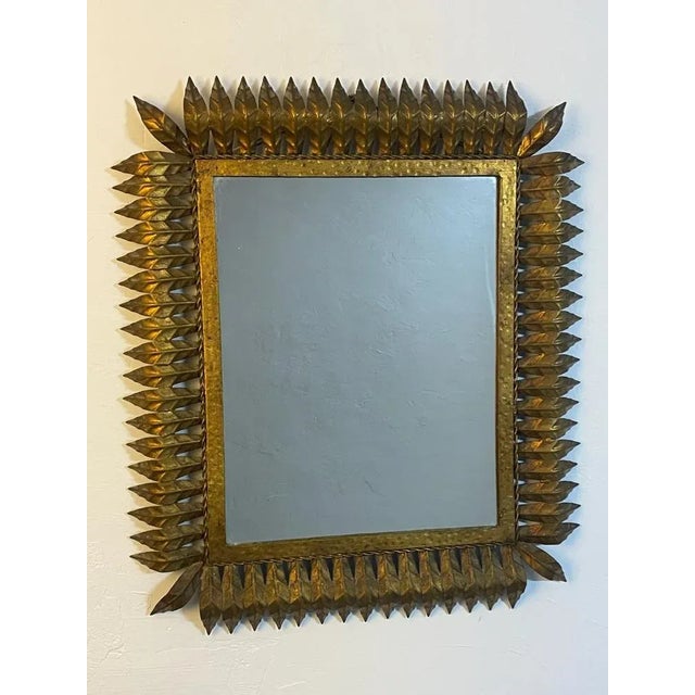 Magnificent rectangular sun mirror in wrought iron from the 1950s. Italian artisanal fabrication, decor of leaves.