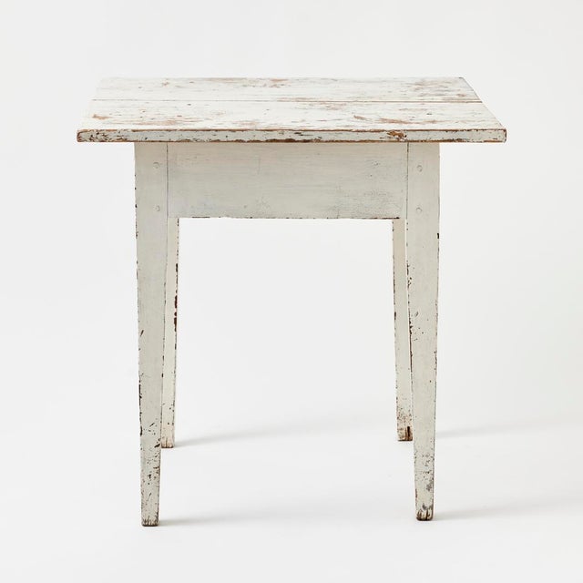 - This antique American side table combines a beautifully worn patina with a simple, pure form. - The distressed white...