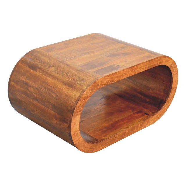 The Chestnut-Finish Mango Wood Curved Coffee Table brings a refined balance of craftsmanship, character, and everyday...