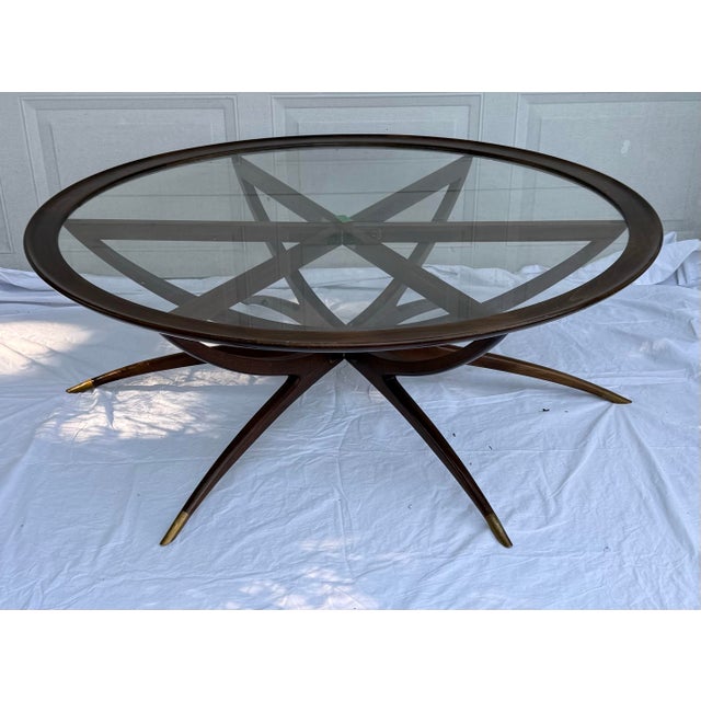 For sale is a Danish Teak Spider leg coffee table similar to those made by Ico Parisi and Vladimir Kagan. It has its glass...