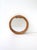 A wicker rattan round wall mirror, circa 1970s–1980s. A small round wall mirror framed in a twisted rattan surround,...