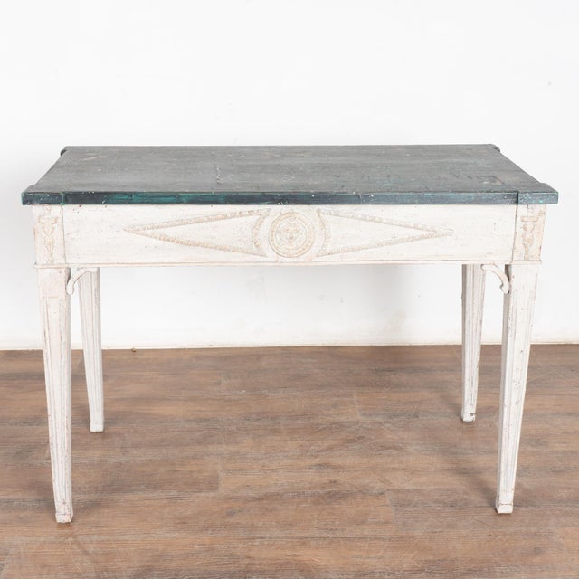 Swedish Gustavian style side table, may also be used as a small desk. Lovely tapered fluted legs with applied carved...