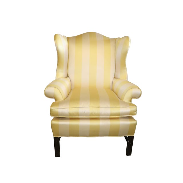 Beautiful Chippendale Wingchair professionally re-upholstered in a beautiful Yellow & Cream Silk Fabric .