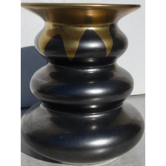 Beautiful glaze of Bronze and gold metallic over the rolling sides of this modernist-shaped vase. Glaze outside and...