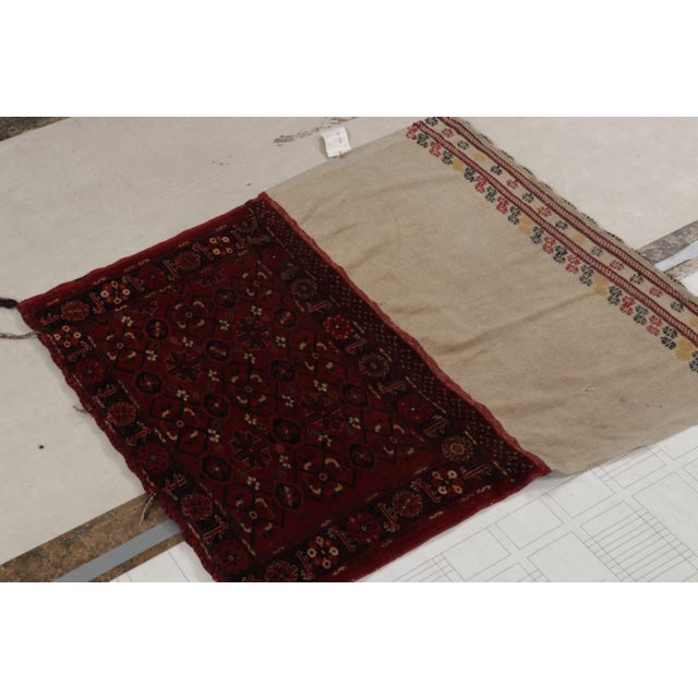 Handwoven in wool, this 4’3 x 4’9 textile is a collectible antique tribal bag, believed to originate from Russia circa...