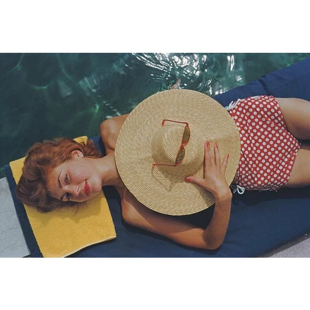 Sunbathing in Burgenstock 1955 Lilian Hanson, sunbathing by a pool at the Burgenstock Resort in Canton Nidwalden,...