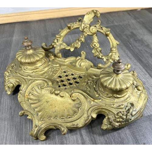 This refined Vintage French brass inkwell set presents elegant Rococo-inspired detailing and a well-balanced, decorative...