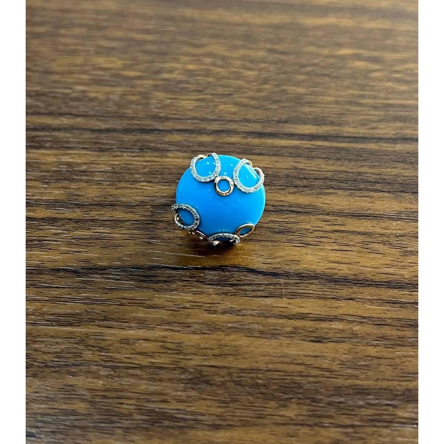 Discover the allure of our exquisite ring, a masterpiece of modern elegance. Crafted with a captivating blue turquoise,...