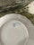 The backstamp on the underside of this plate identifies it as antique German porcelain produced by the Erdmann...