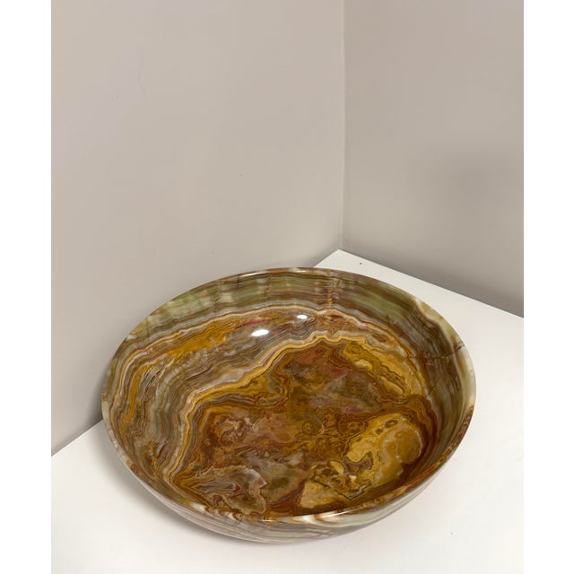 Beautiful vintage 14-inch hand-carved bowl made from natural Afghanistan banded calcite, sometimes called banded “onyx.”...