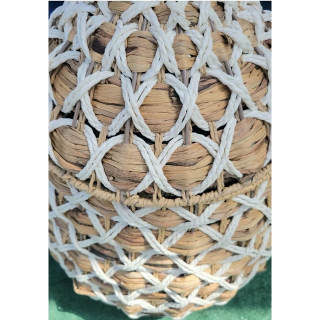 A wonderful very large braided weaved water Hyacinth pineapple shaped clothing hamper. The piece was used just as a room...