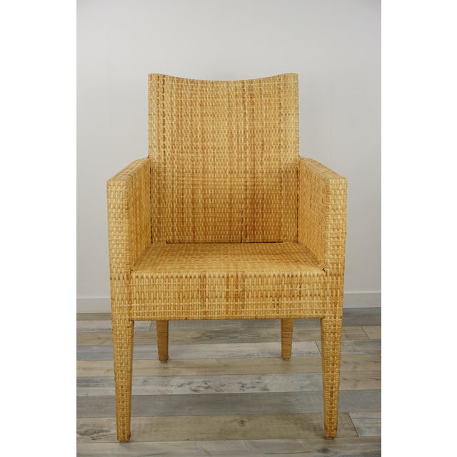 A bridge-style armchair with a wooden frame covered in hand-woven rattan. Place it around your dining table, at your desk,...