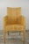 A bridge-style armchair with a wooden frame covered in hand-woven rattan. Place it around your dining table, at your desk,...