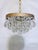 Bring romance and vintage texture to your home with this enchanting mid-century tiered brass rim and Swedish crystal drops...