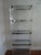 Stunning and Timeless Lucite etagere designed by Charles Hollis Jones. The lucite is joined with polished stainless steel...