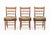 Group of Three American Rush Seat Ladder Back Side Chairs, each with floral design needlework cushions. 32" H x 17.5" W x...